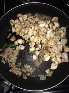 After the raw smell goes add the mushrooms and give it a quick stir.